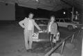 Photograph: [Byrd IV and Victoria Clary standing next to a car #2]