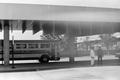 Photograph: [A parked bus and two men #1]