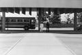 Photograph: [A parked bus and two men #3]