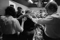 Photograph: [Churchgoers bless man during service]