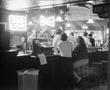 Photograph: [Customers at an Atlanta bar]