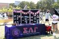Photograph: [Table and poster board from Sigma Lambda Gamma National Sorority]