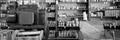 Photograph: [Panoramic of shelves and a cash register]