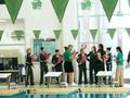 Primary view of [UNT women's swim team receives flowers after New Orleans match]