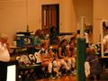 Photograph: [Cassie Headrick speaks to UNT volleyball players during UALR match]
