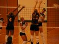 Primary view of [Ana Buccini and Sarah Breedlove attempt to block spike by UNT player]