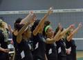 Photograph: [UNT volleyball players do eagle claw during match]