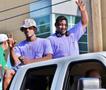 Photograph: [Two fraternity members at 2012 Homecoming Parade]
