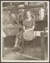 Thumbnail image of item number 1 in: '[Factory worker seated at her station]'.