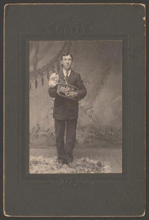 Primary view of object titled '[Clyde Tremor holding a trumpet]'.