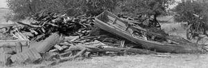 Primary view of object titled '[Panoramic photo of a pile of wood and metal debris]'.
