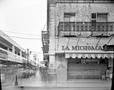 Photograph: [La Michoacán store at the entrance to a market area]