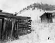 Photograph: [Two snow covered sheds in the New Mexican mountains]