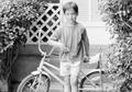 Photograph: [Boy poses with bicycle in South Hills]