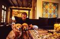 Photograph: [Mike Modano holding onto his two dogs]