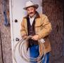 Thumbnail image of item number 1 in: '[Barry Corbin holding a lasso]'.