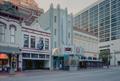 Photograph: [Sundance theatre with a shoe store and Italian restaurant next door]