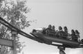 Photograph: [A woman and five girls on an amusement ride at Six Flags Over Texas]
