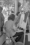 Photograph: [A girl getting her portrait drawn at Six Flags Over Texas in Arlingt…