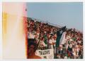 Thumbnail image of item number 1 in: '[UNT flag displayed by members of Talons at a football game]'.