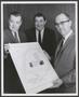 Thumbnail image of item number 1 in: '[Photograph of W. K. Stripling Jr., Charles D. Tandy, and Paul Leonard holding a map]'.