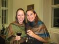 Photograph: [Two women wearing cloth shoulder wraps and holding wineglasses]