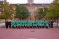 Photograph: [Trombone students and trombone faculty posing in front of a building…