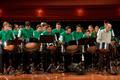 Photograph: [Rows of percussionists in green shirts performing onstage, 4]