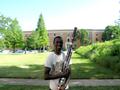 Photograph: [A man in a white t-shirt posing with a bassoon, 2]