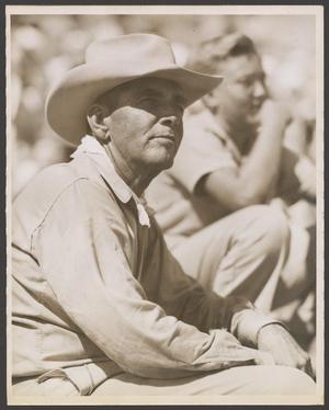 Primary view of object titled '[Man at a livestock show, wearing a cowboy hat]'.