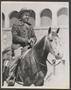 Thumbnail image of item number 1 in: '[A man on horseback and smiling, at a livestock show]'.