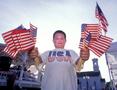 Photograph: [Mallory Stewart handing out American flags]