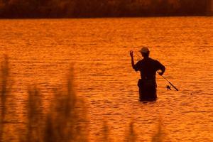 Primary view of object titled '[Solitude in Sunset: Angler's Delight on Lake Amistad]'.