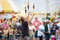 Primary view of [People enjoying the juggling show at the East Texas State Fair]