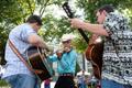 Photograph: [Melodic Festivities: Musicians and Crowds Gather at Athens, Texas Fe…