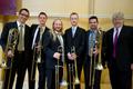 Photograph: [Steve Wiest with One O'Clock Lab Band trombone section at the 15th W…