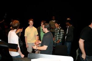 Primary view of object titled '[Chad Willis converses with students at UNT Alumni Day event]'.
