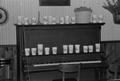 Primary view of [Cups on a piano at the home of Willard Watson, "The Texas Kid", 1]