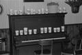 Thumbnail image of item number 1 in: '[Cups on a piano at the home of Willard Watson, "The Texas Kid", 3]'.