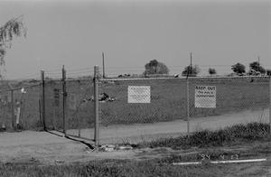 Primary view of object titled '[A view of the Branch Davidian Compound, fenced-off, 3]'.