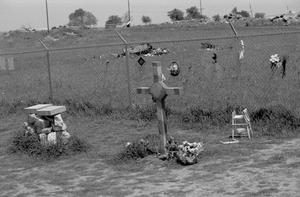 Primary view of object titled '[A cross in front of the Branch Davidian Compound]'.