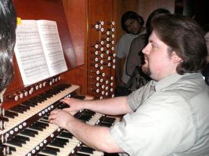 Primary view of object titled '[Gregg Bailey Playing the Opus 100 Organ]'.