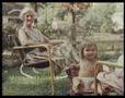 Photograph: [Child and Grandmother in Backyard]