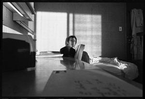 Primary view of object titled '[Boy in a Dorm Room]'.