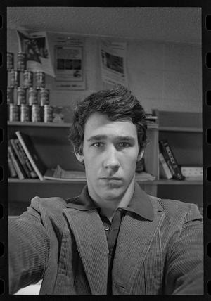 Primary view of object titled '[Man in Front of a Bookshelf]'.