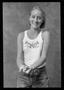 Photograph: [Woman wearing a tank top posed in a studio]
