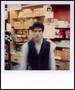 Photograph: [Blurry man in a store]