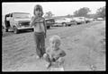 Photograph: [Children in a dirt field]
