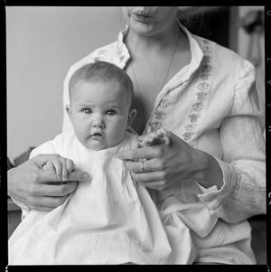 Primary view of object titled '[Woman holding an infant in a white gown]'.