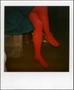 Photograph: [Person wearing a blue dress and red socks]